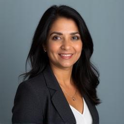 Professional portrait of Dr. Anya Sharma, Lead Investigative Journalism Trainer